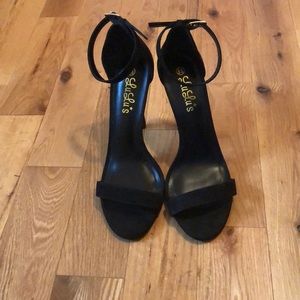 Never worn Strappy black sandal heel!